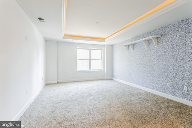 7902 Brynmor Ct Unit 201, Pikesville, MD 21208 - carpeted spare room featuring a tray ceiling and baseboards