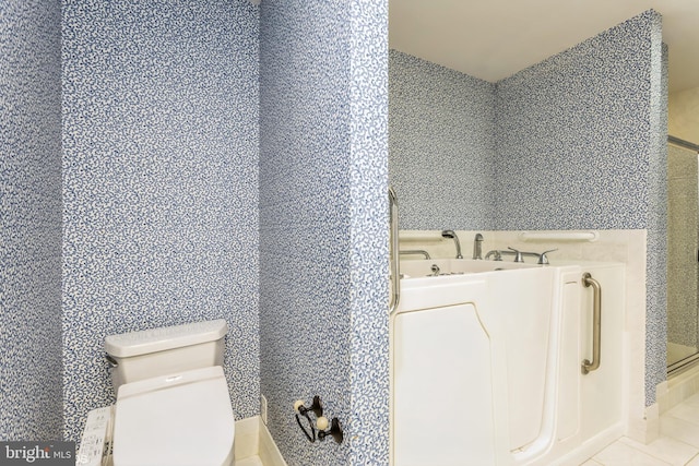 7902 Brynmor Ct Unit 201, Pikesville, MD 21208 - bathroom featuring toilet, a bath, and tile patterned flooring