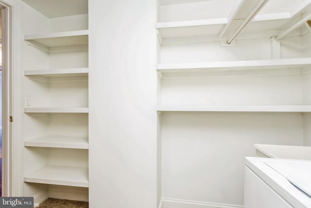 spacious closet with washer / clothes dryer