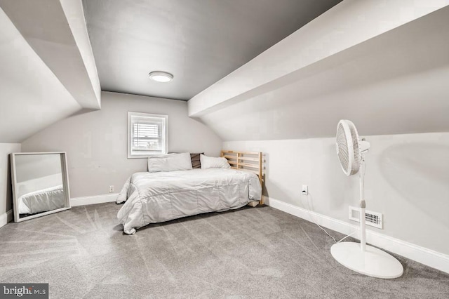 bedroom featuring light carpet and lofted ceiling