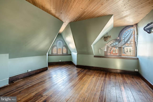 bonus room featuring wood ceiling, dark hardwood / wood-style floors, and vaulted ceiling