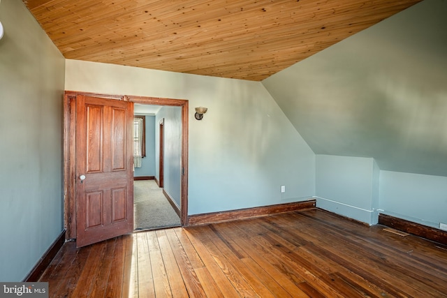 bonus room featuring wood ceiling, dark wood-type flooring, and vaulted ceiling