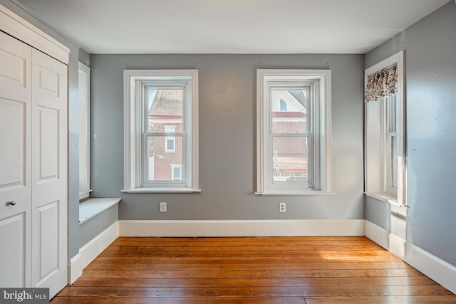 interior space with wood-type flooring and a wealth of natural light