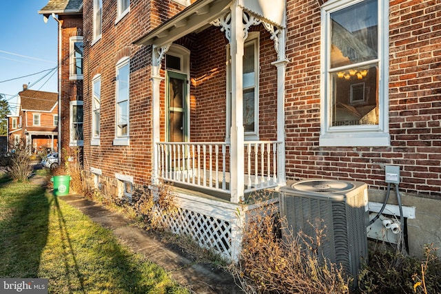 view of side of property with central AC unit