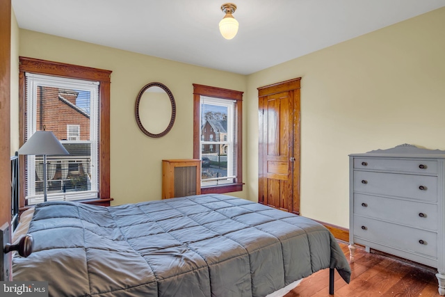 bedroom with hardwood / wood-style flooring