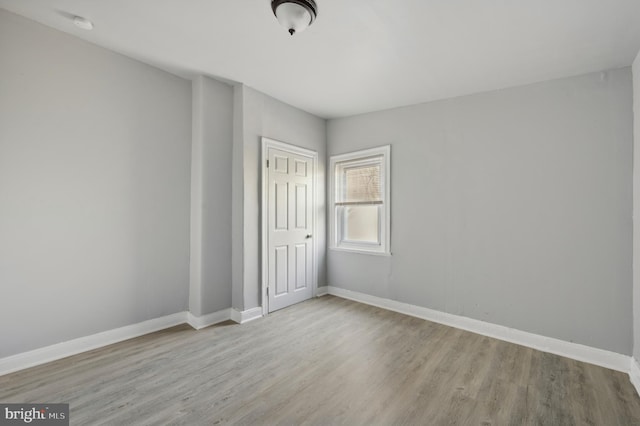 unfurnished room featuring light hardwood / wood-style floors