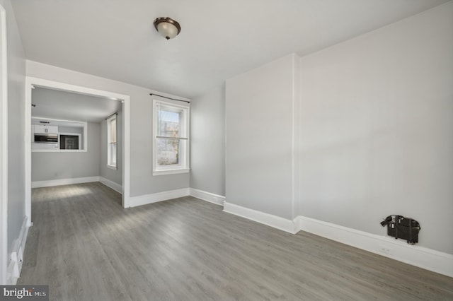 spare room featuring hardwood / wood-style floors