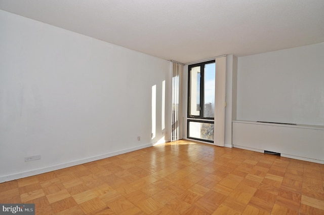 spare room with light parquet floors