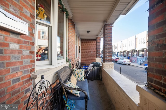 balcony featuring a porch