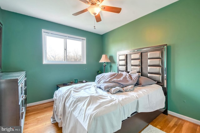 bedroom featuring light hardwood / wood-style floors and ceiling fan