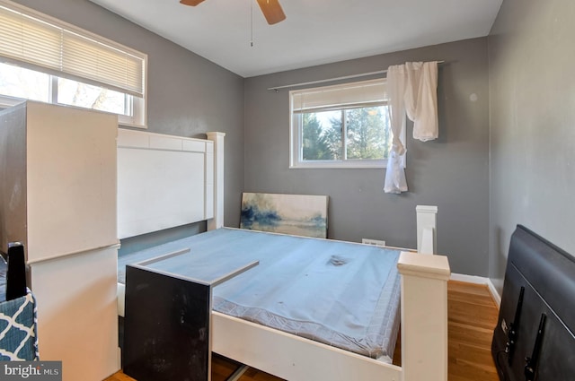 bedroom featuring hardwood / wood-style floors and ceiling fan