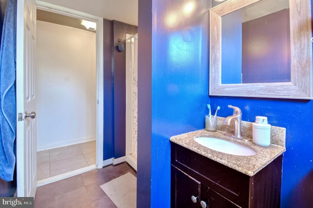 bathroom featuring tile patterned flooring and vanity