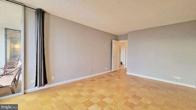 spare room featuring light hardwood / wood-style floors