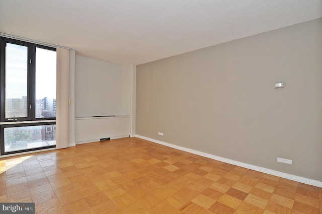 empty room with light parquet floors