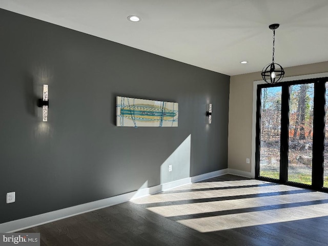 unfurnished room featuring hardwood / wood-style flooring