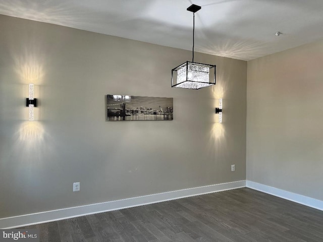 unfurnished dining area with dark hardwood / wood-style floors