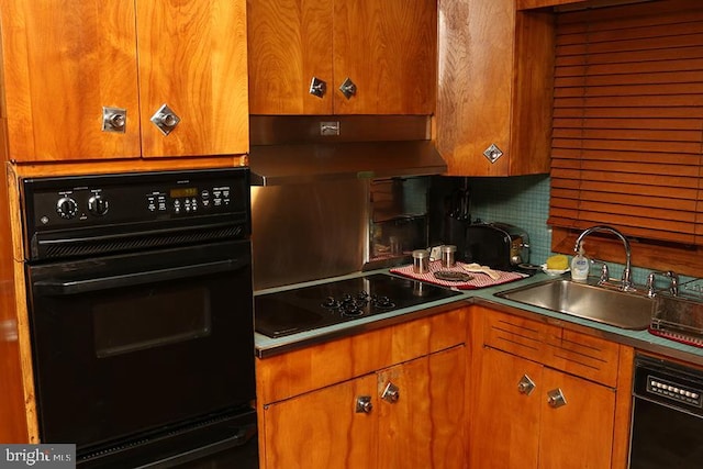 kitchen featuring tasteful backsplash, sink, and black appliances