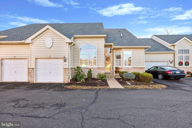 view of front of property with a garage