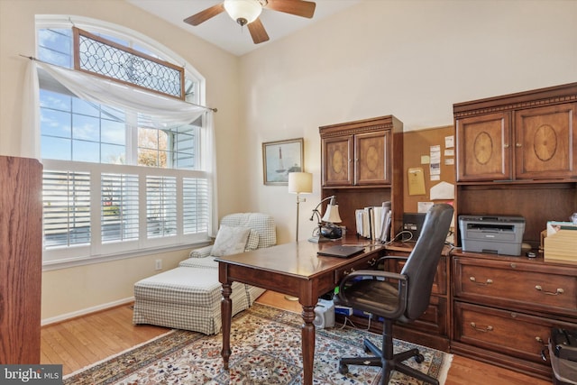 home office featuring ceiling fan and light wood-type flooring