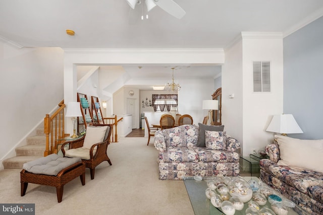 carpeted living room with ceiling fan with notable chandelier and crown molding