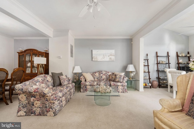 carpeted living room featuring ceiling fan and crown molding