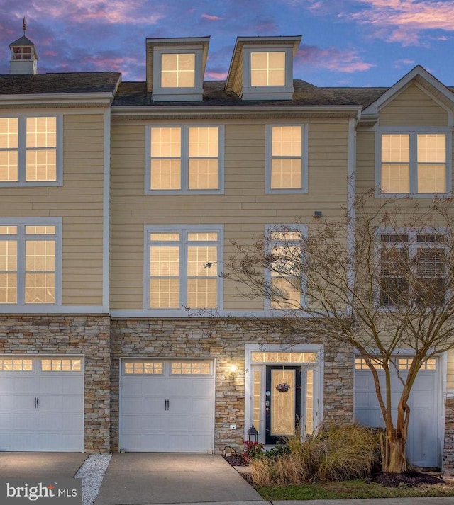 4 Bay View Ln, Colonial Beach, VA 22443 - view of property with stone siding, an attached garage, and driveway