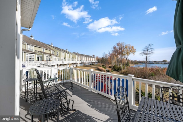 wooden deck with a water view