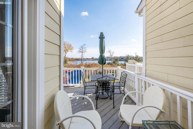 wooden deck with a water view