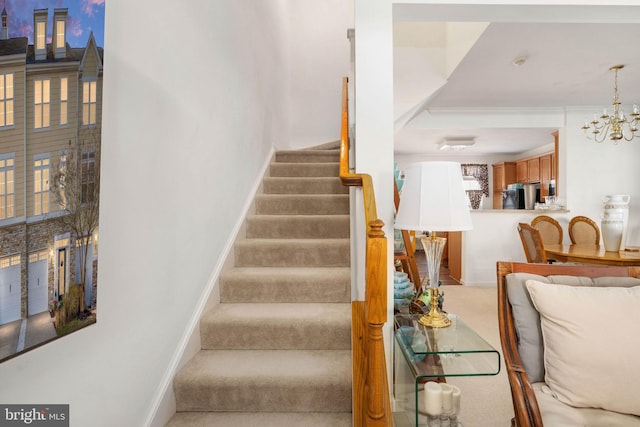 stairs with carpet and a chandelier