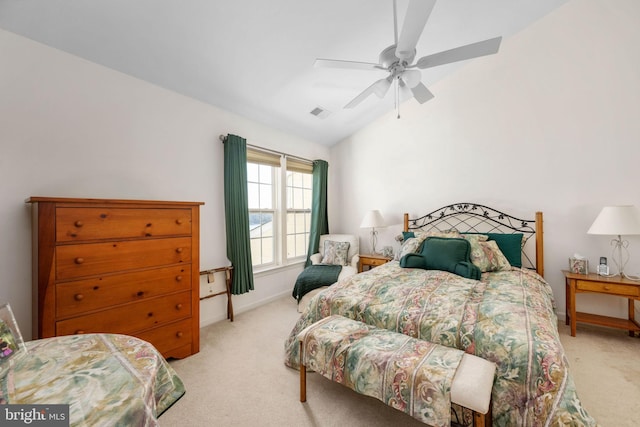 bedroom featuring ceiling fan, light colored carpet, and vaulted ceiling