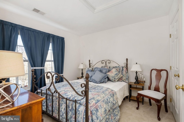 bedroom with light colored carpet