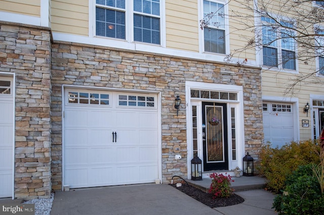 4 Bay View Ln, Colonial Beach, VA 22443 - view of exterior entry featuring stone siding and an attached garage