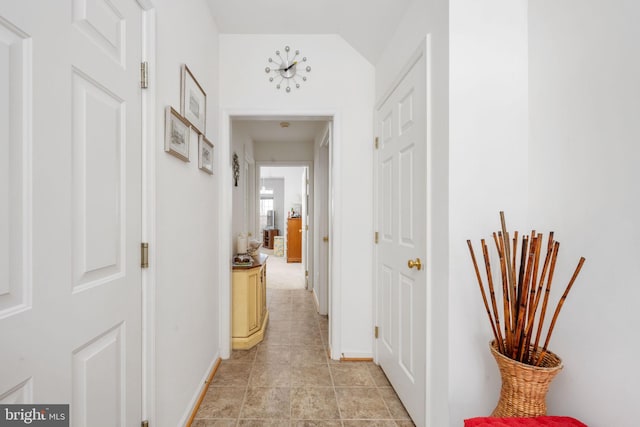 4 Bay View Ln, Colonial Beach, VA 22443 - corridor featuring baseboards, vaulted ceiling, and light tile patterned flooring
