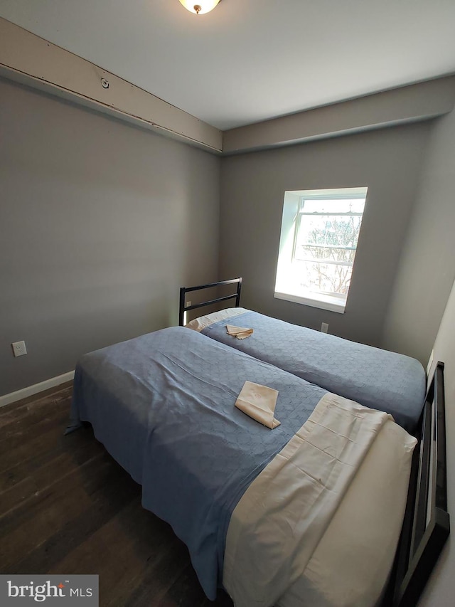 bedroom featuring dark wood-type flooring