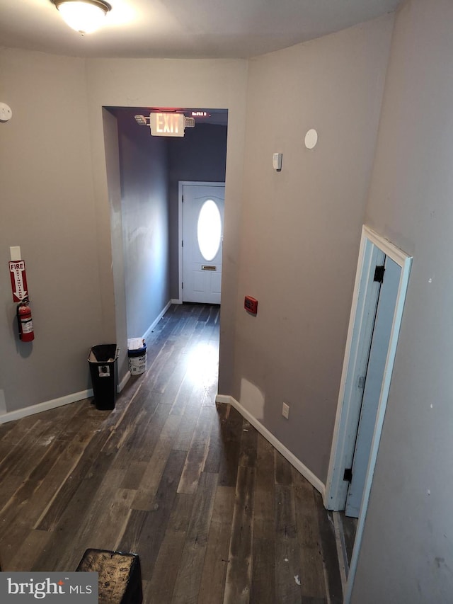 hall featuring dark wood-type flooring