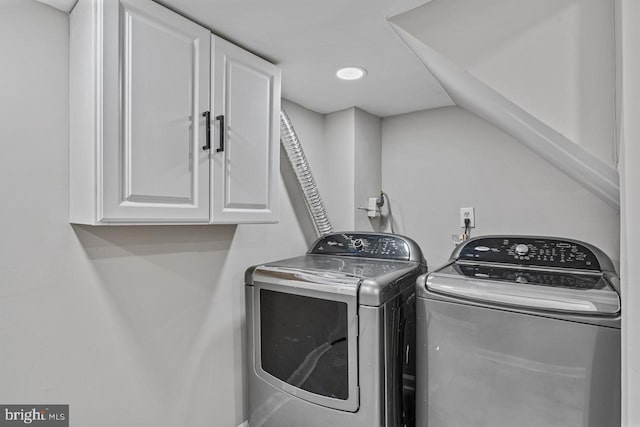 laundry area with cabinets and washer and dryer