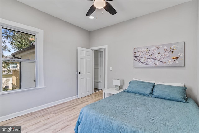 bedroom featuring light hardwood / wood-style flooring and ceiling fan