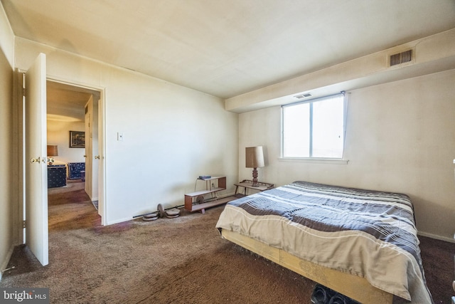 bedroom with dark carpet