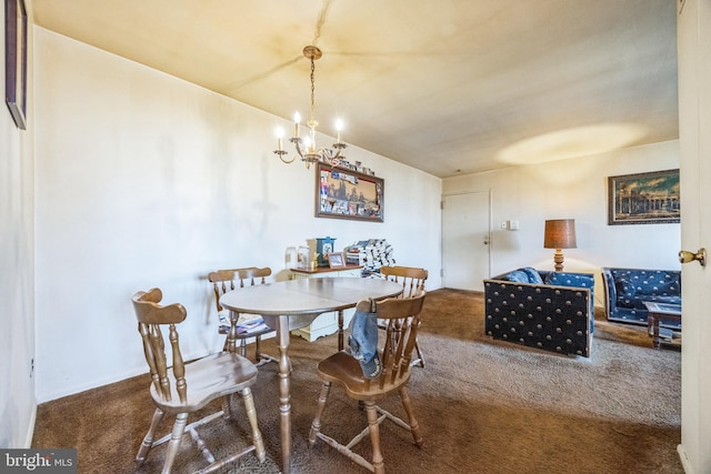 dining area featuring carpet flooring and an inviting chandelier