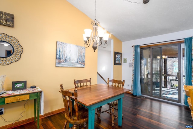 dining space featuring vaulted ceiling, dark hardwood / wood-style flooring, and a chandelier