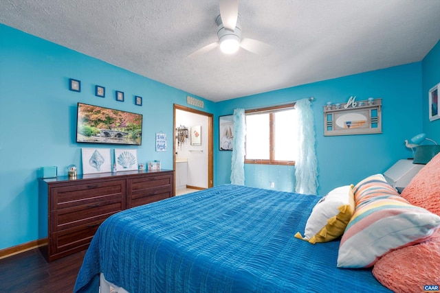 bedroom featuring a textured ceiling, ensuite bath, ceiling fan, and dark hardwood / wood-style floors