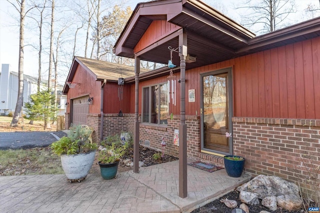 doorway to property featuring a garage