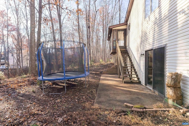 view of yard with a trampoline