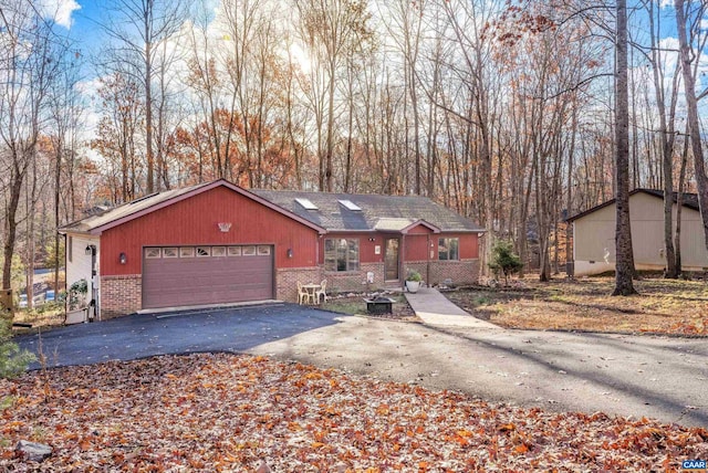 ranch-style home featuring a garage