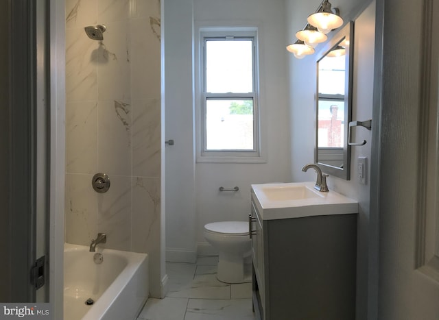 full bathroom featuring vanity, toilet, and tiled shower / bath combo