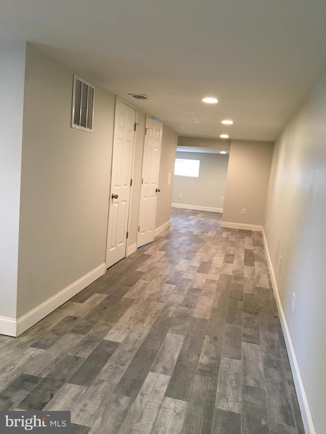 basement featuring dark wood-type flooring