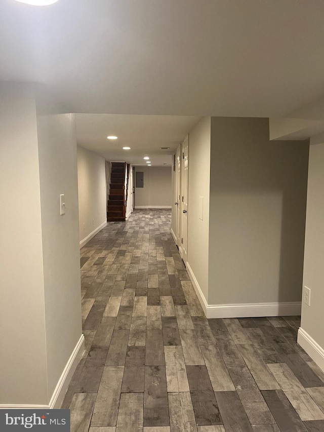 hallway featuring dark hardwood / wood-style flooring