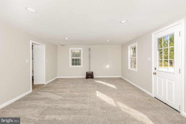 unfurnished room with light carpet