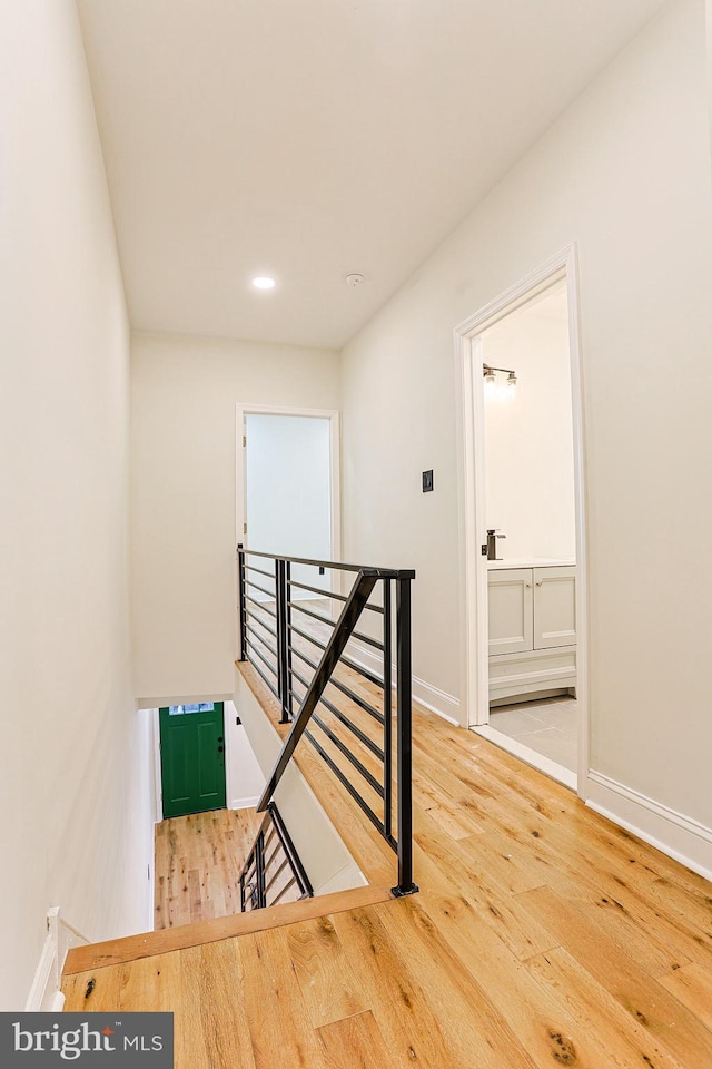 staircase featuring hardwood / wood-style floors