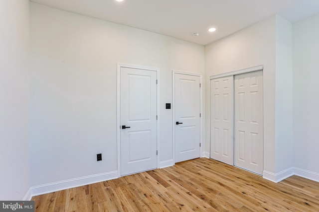 unfurnished bedroom featuring light hardwood / wood-style flooring